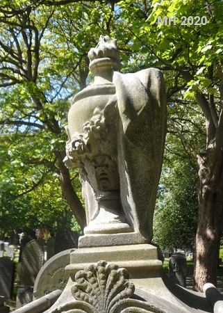 draped urn with garland